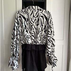 BRAND NEW! Black & white zebra print short romper. By Fashion Nova size XL.